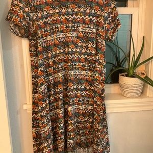 LuLaRoe high low dress fits like a small. Cute, fun pattern. Great for summer.